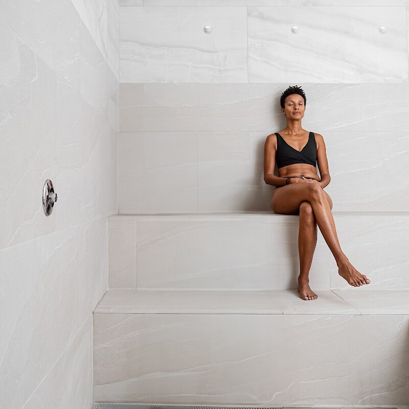 A woman relaxing in a steam room